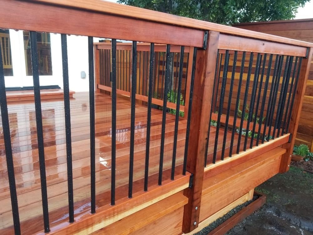 Fence with black metal panels