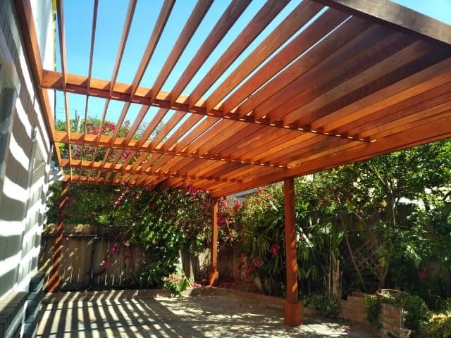Contemporary redwood pergola over a patio